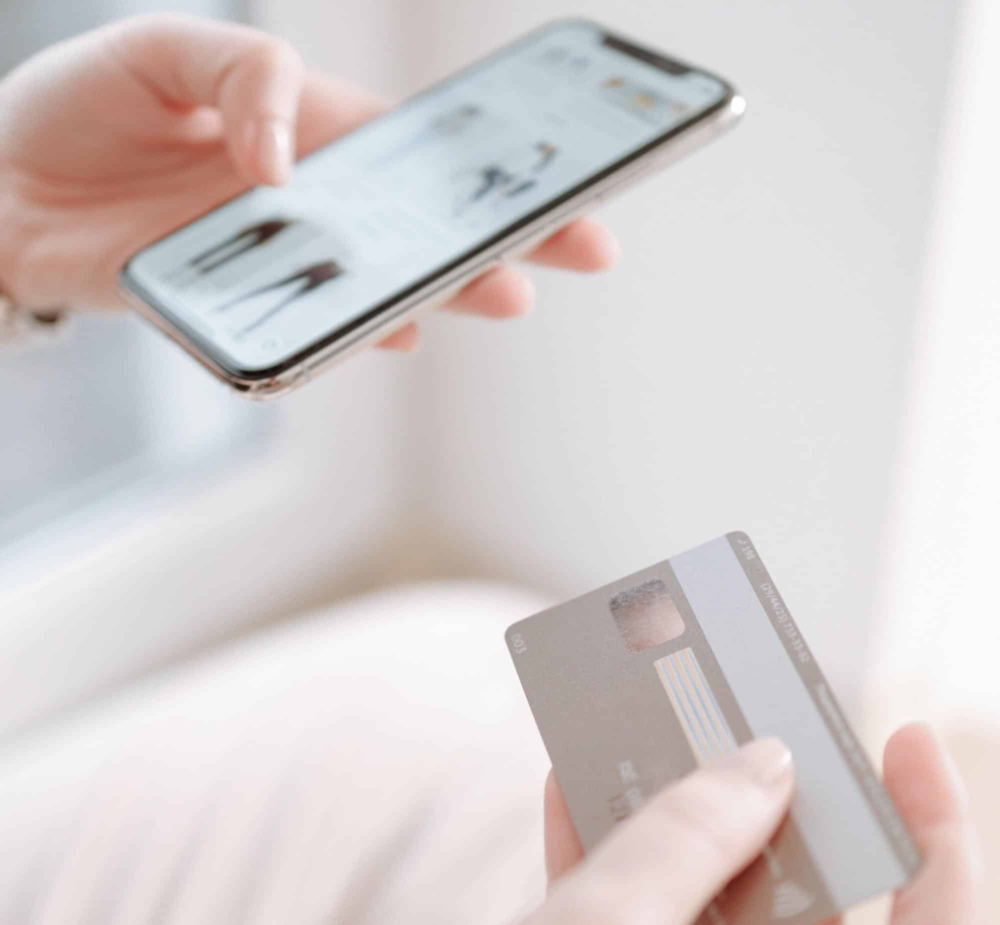 How to Increase and Encourage eCommerce Impulse Buying 3 Person holding phone and credit card.