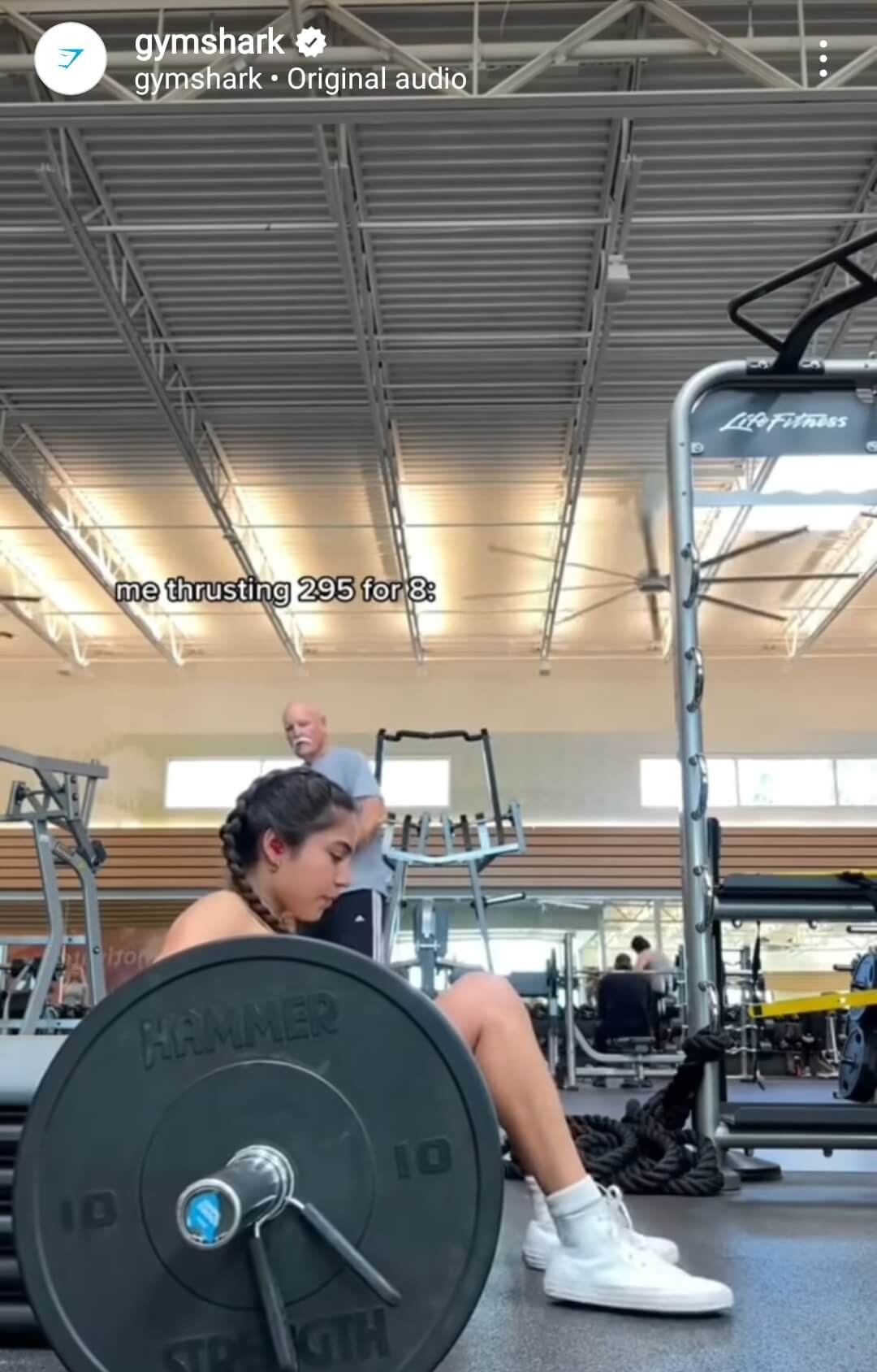 Print, Discovery Commerce, and Sustainability in 2023 and Beyond 1 Girl pushing large weights in gym shown on Gymshark social channel.