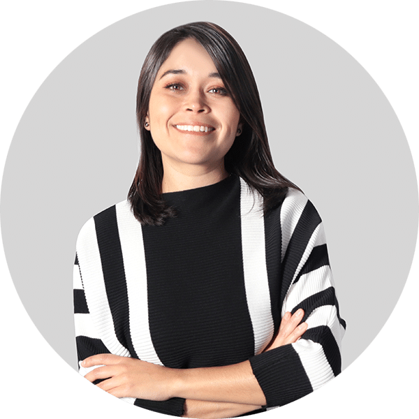 Headshot of Andrea Hernandez — Woman in black and white sweater.