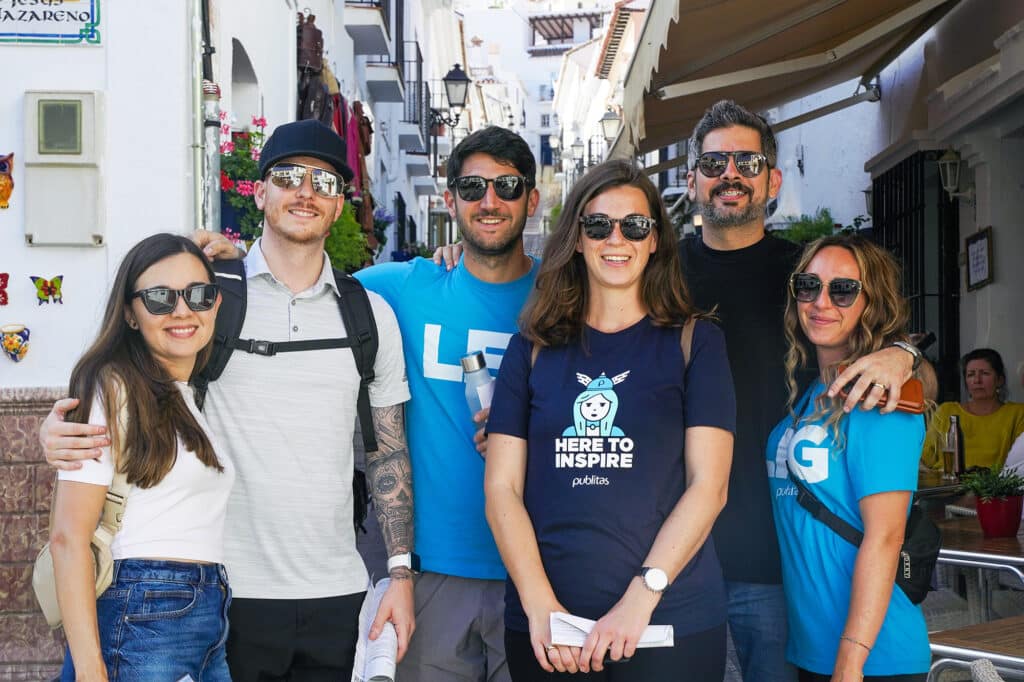 A small group of Publitas employees wearing sunglasses visiting Mijas.