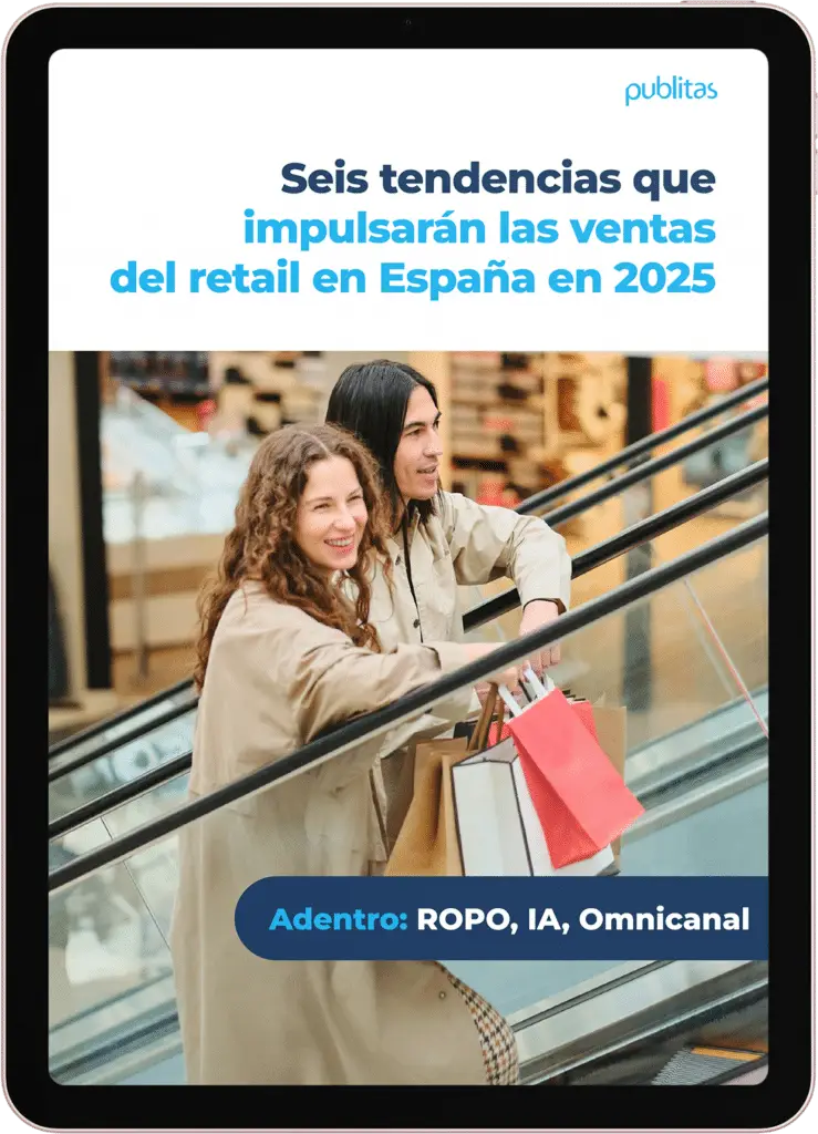 ebook: seis tendencias que impulsaran las ventas del retail en Espana. Pareja en una escalera mecánica sosteniendo bolsas de compras en un centro comercial.