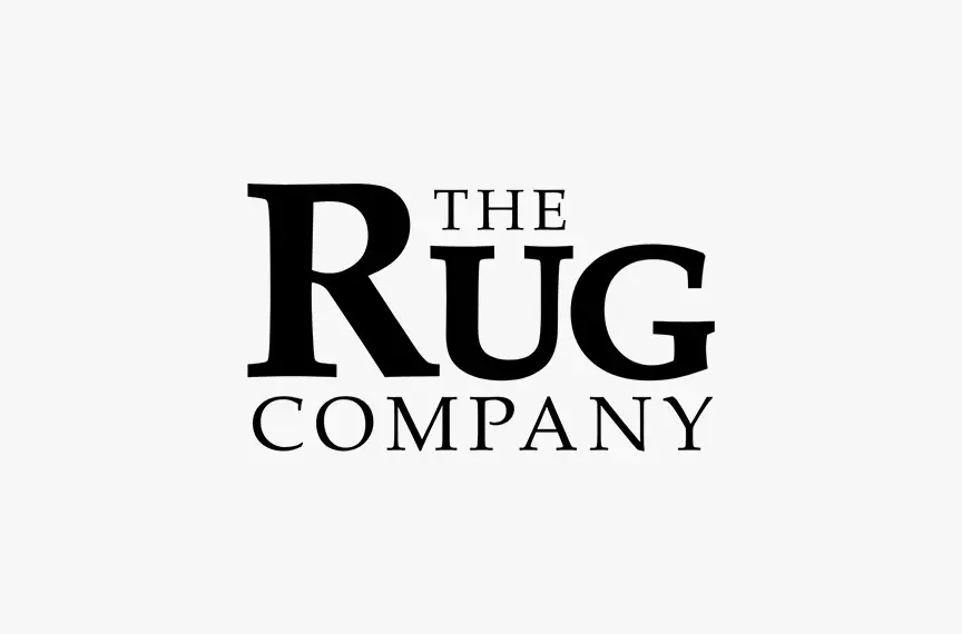 The Rug Company logo on a grey background