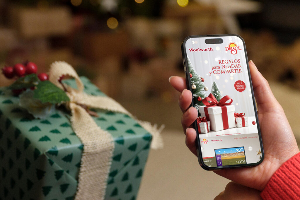 person in red sweater holding a phone with woolworth catalog Publitas